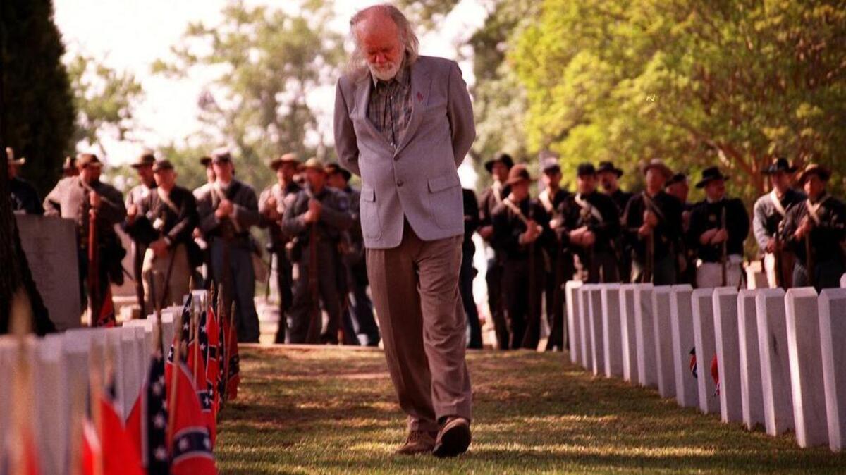 Descendants of Confederate soldiers observe a Confederate Memorial Day service in Columbia’s Elmwood Cemetary.