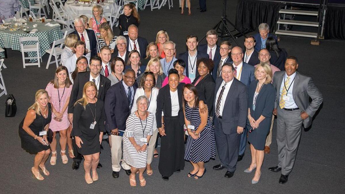 USC women’s basketball coach Dawn Staley poses for a photo with Circuit Judge Dennis Shedd and a few of the other judges and lawyers she wowed at the Fourth Circuit Judicial Conference.