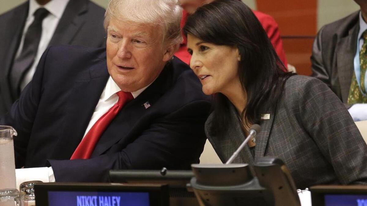 President Donald Trump speaks with UN. Ambassador Nikki Haley