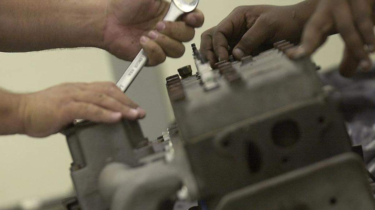 Apprentices work on restoring a pickup truck as part of a registered SC apprenticeship program.