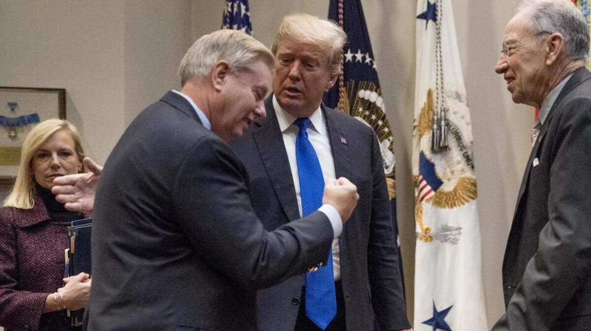 President Donald Trump greets Sen Lindsey Graham and Sen Chuck Grassley during last week’s infamous White House meeting on immigration reform.