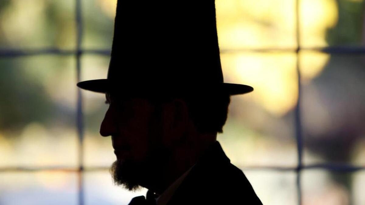 Jim Getty of Gettysburg, Pa., appears in silhouette as President Abraham Lincoln. Getty will once again deliver the Gettysburg Address in Gettysburg on the 150th anniversary of the celebrated speech. (Michael S. Wirtz/Philadelphia Inquirer/MCT)