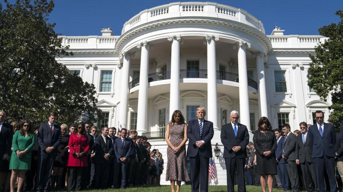 President Donald Trump and first lady Melania Trump stand with Vice President Mike Pence and his wife, Karen Pence, during a moment of silence for the victims of the mass shooting in Las Vegas.