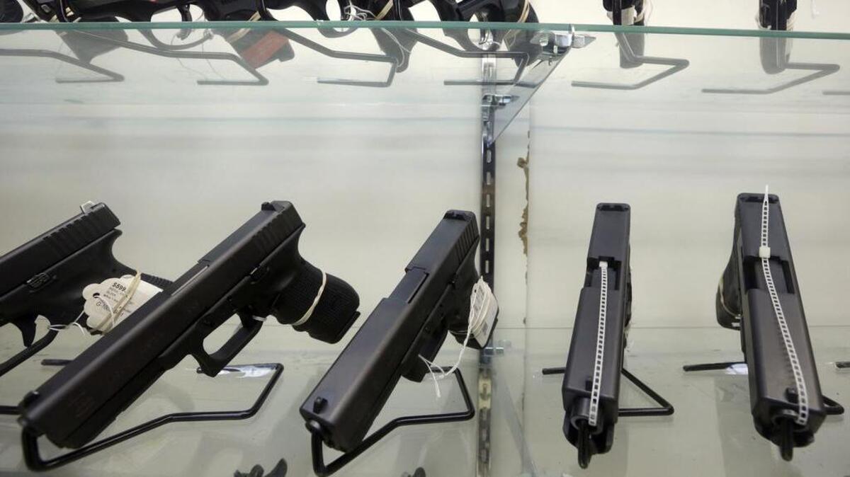 Guns on display in a store.