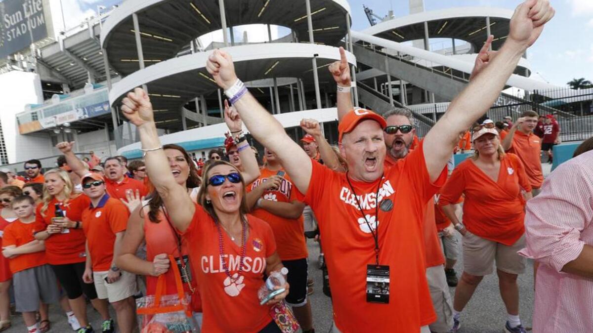 Clemson fans cheer before the the Orange Bowl NCAA semifinal college football game.