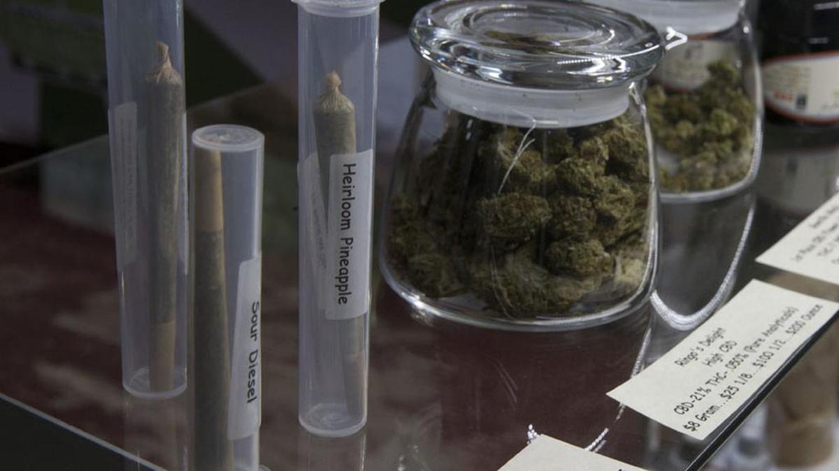 Marijuana products, including pre-rolled cigarettes and buds, are displayed at a medical marijuana dispensary in California.