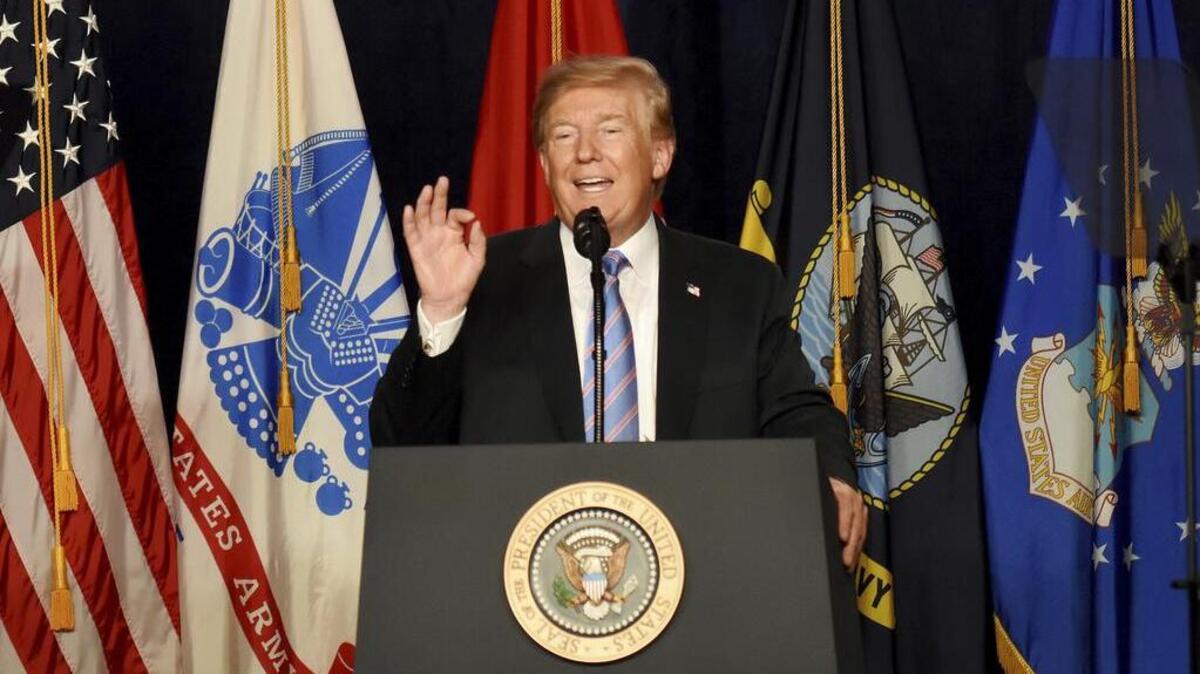 President Donald Trump gestures to the audience during his remarks at a Salute to Service charity dinner in conjunction with the PGA Tour’s Greenbrier Classic at The Greenbrier in White Sulphur Springs, W.Va., Tuesday, July 3, 2018. Trump celebrated active-duty service members and veterans during a military tribute Tuesday on the eve of Independence Day. (AP Photo/Chris Jackson)