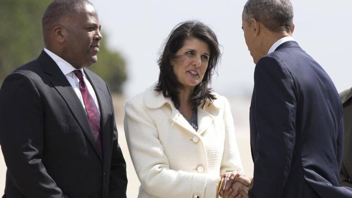 SC Gov. Nikki Haley greets President Barack Obama upon his arrival in Columbia earlier this year.