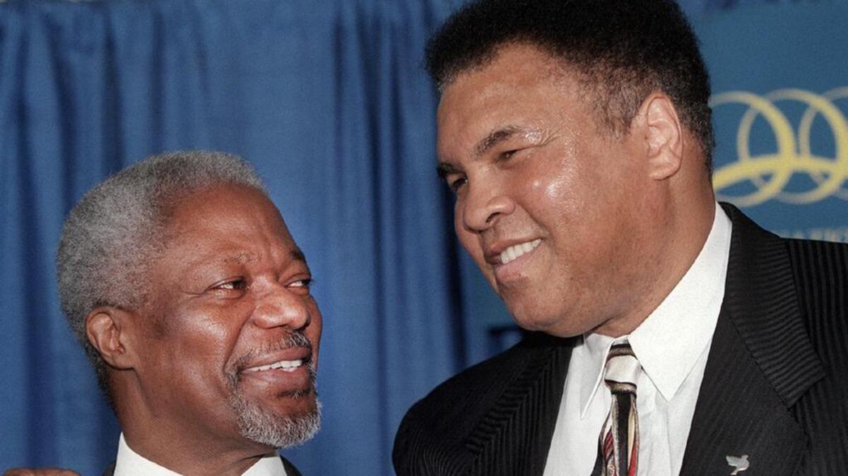 In this Oct. 23, 2000, photo, U.N. Secretary-General Kofi Annan jokes with boxing great Muhammad Ali during a photo session with U.N. Messengers of Peace at the United Nations.