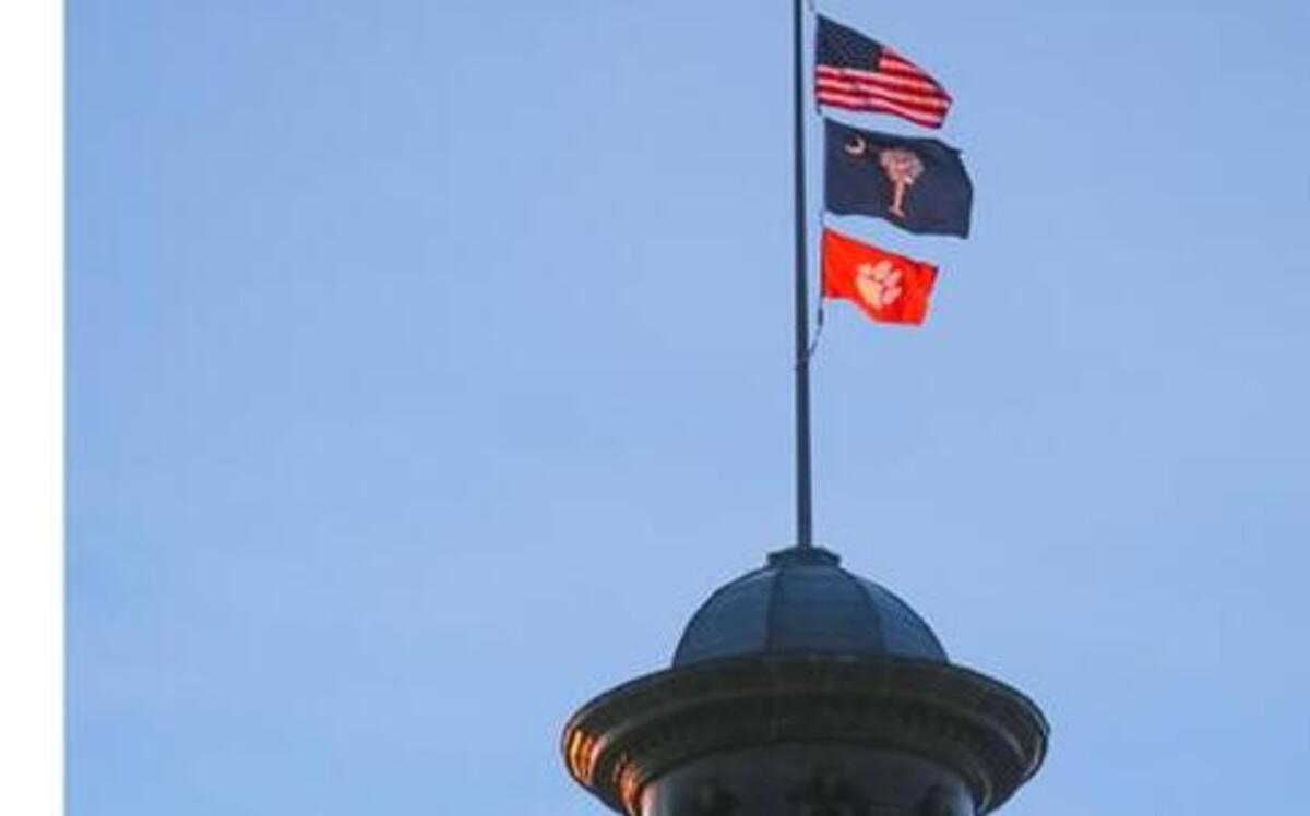 Clemson’s tiger paw flag flies over the State House after the school won the national championship in January.