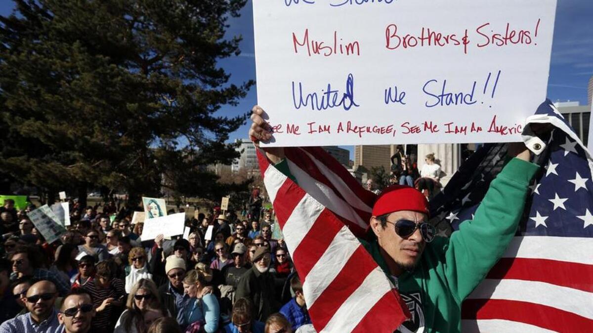 Thousands gather at Denver’s City Center Park for a rally in support of the Muslim community and to protest President Donald Trump’s executive order to temporarily ban refugees from seven mostly Muslim countries.