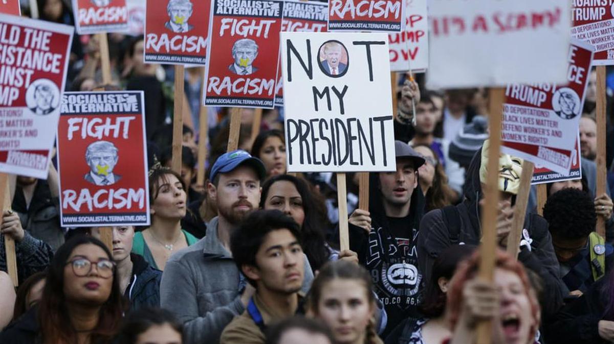Demonstrators protest the election of Donald Trump.