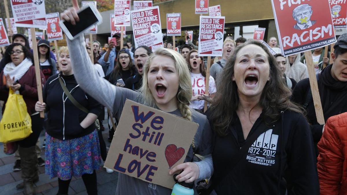Demonstrators protest the election of President-elect Donald Trump.