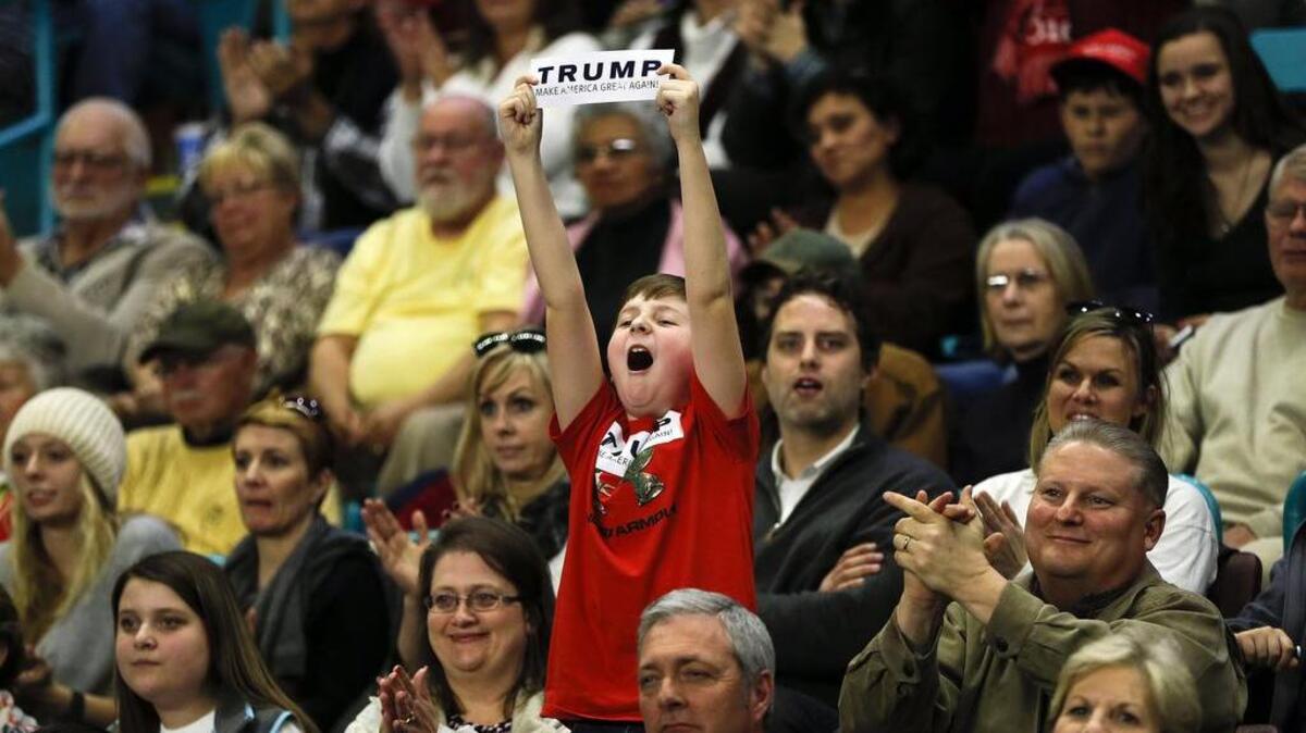 A child reacts to Republican presidential candidate Donald Trump during a Feb 5 campaign rally in Florence.