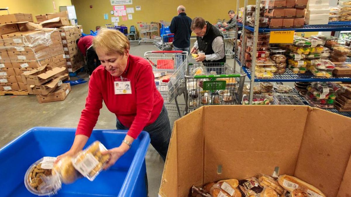 Volunteers at Harvest Hope Food Bank sort donations.