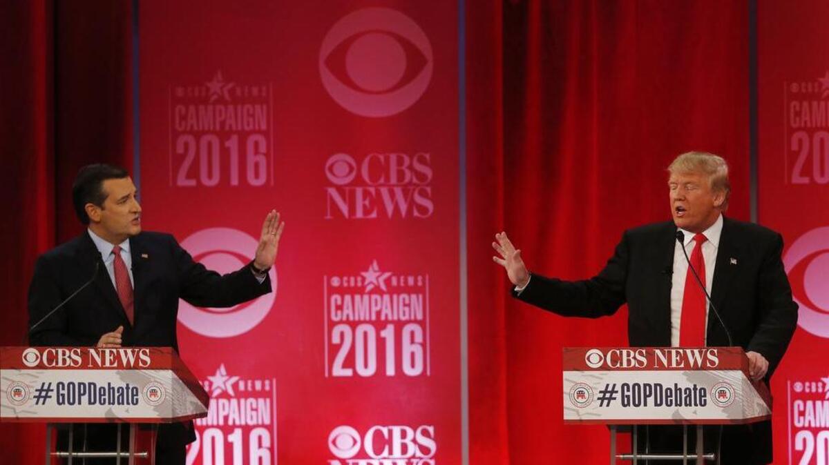 Sen. Ted Cruz, R-Texas, and businessman Donald Trump participate in the GOP presidential debate in Greenville on Saturday.