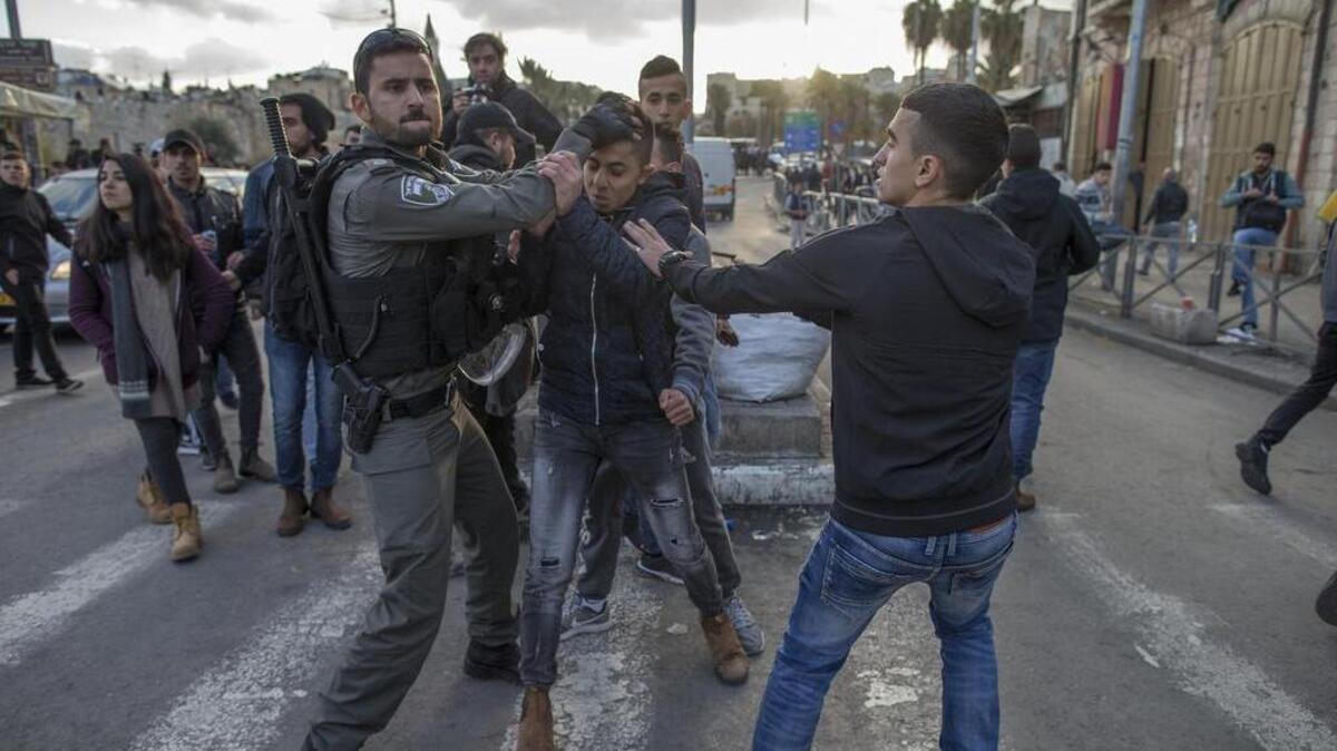 In this New York Times file photo from December 2017, Israeli police clash with Palestinian demonstrators at the Damascus Gate outside the Old City of Jerusalem, Dec. 7, 2017.  A petition from Triangle Jewish Voice for Peace and other groups calls on the Durham City Council not to have any police department partnerships with Israeli police or defense forces, or any countries that engage in military-style policing.