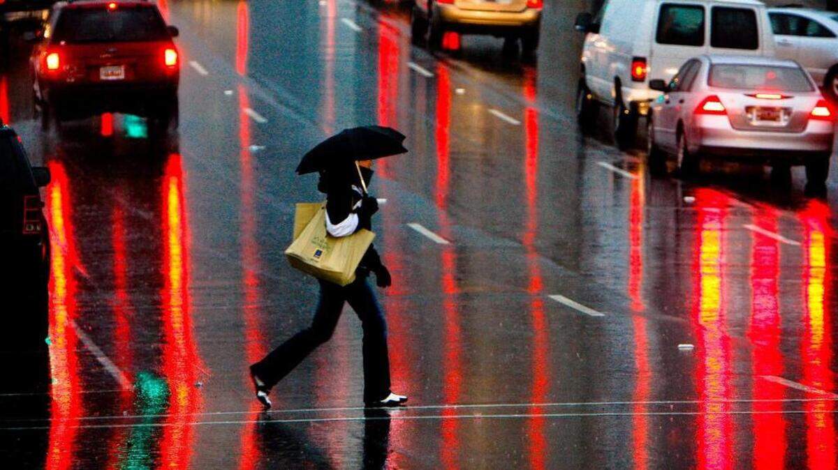A pedestrian crosses Assembly Street near the Koger Center.