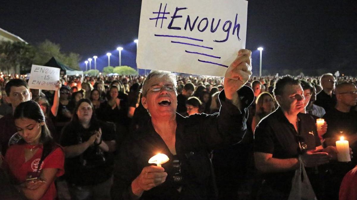 Mourners attend a candlelight vigil for shooting victims from Marjory Stoneman Douglas High School.
