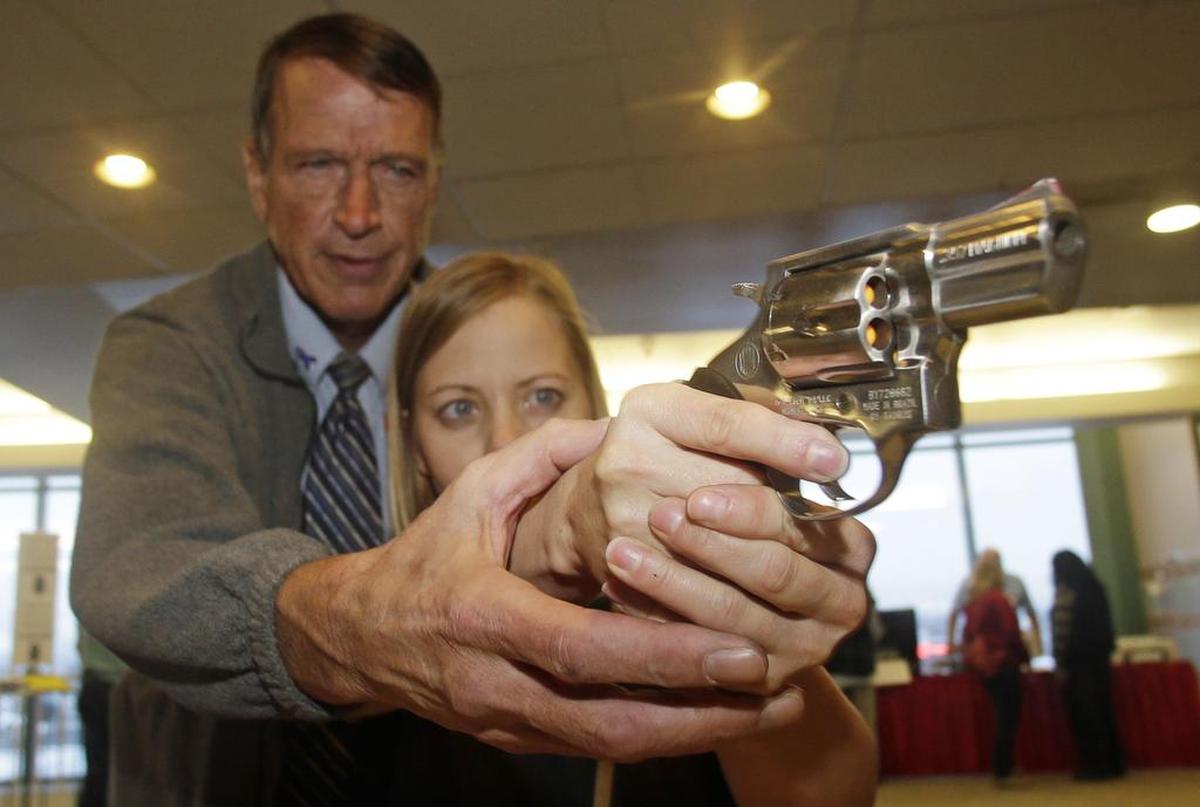 A fourth-grade teacher receives firearms training with a .357 magnum during concealed weapons training.