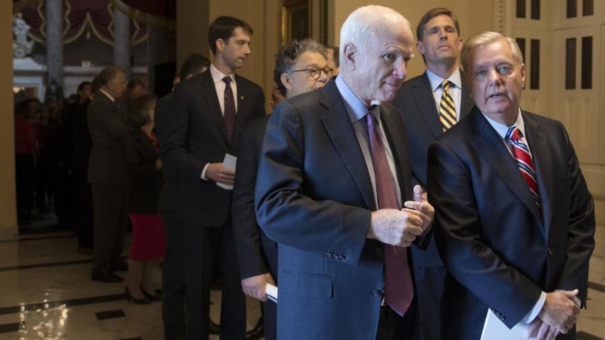 Senate Armed Services Chairman John McCain, R-Ariz, confers with Sen. Lindsey Graham, R-SC.