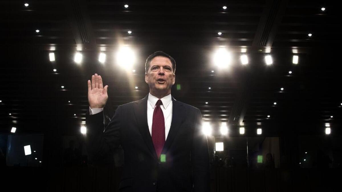 Former FBI Director James Comey is sworn in during a Senate Intelligence Committee hearing in June.