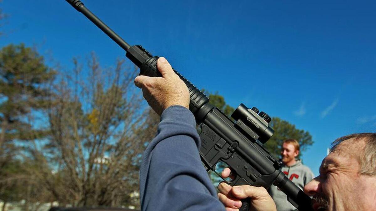 Howell Hinson checks out a Palmetto State Armory AR-15.