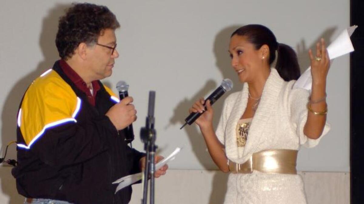 Al Franken and Leeann Tweeden perform a skit during a USO tour in Mosul, Iraq, in this Dec. 16, 2006, handout photo provided by the U.S. Army. Tweeden, a radio newscaster, has accused Sen. Franken , of kissing and groping her without consent during the tour.