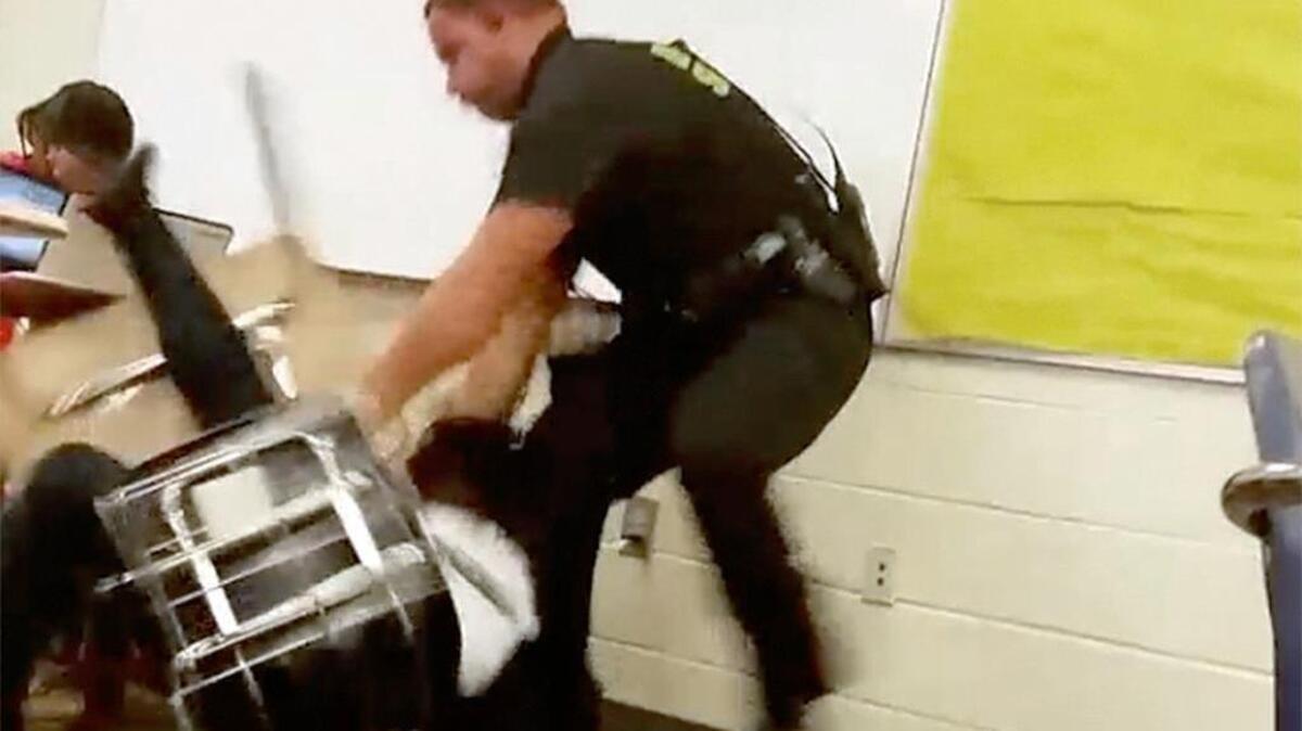 Then-Richland County Deputy Ben Fields tries to remove a student who refused to leave her Spring Valley High School math class in October.