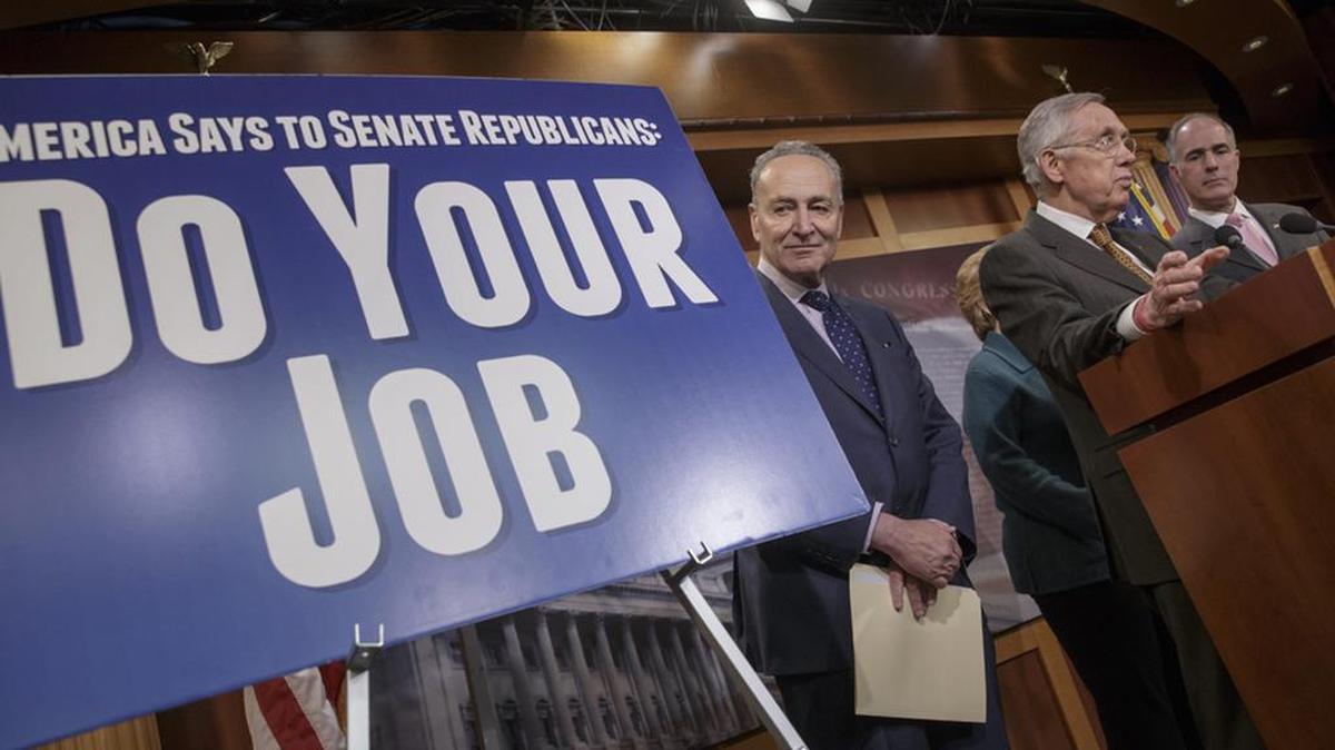 Democratic US Sens Charles Schumer, Debbie Stabenow, Harry Reid and Robert Casey call on Republicans to allow a confirmation hearing last year for Judge Merrick Garland, President Barack Obama’s choice to replace the late Justice Antonin Scalia on the Supreme Court.