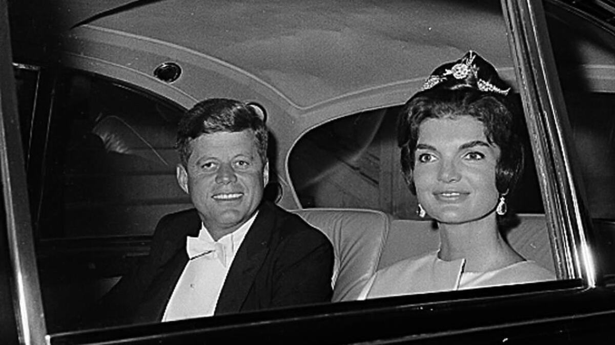 U.S. President John F. Kennedy and first lady Jacqueline Kennedy are shown in a car as they leave their residence at Quai D’Orsay, Paris, for a state dinner in the Hall of Mirrors in Versailles, France, June 1, 1961.   (AP Photo)