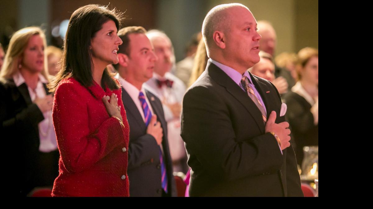 
SC Gov. Nikki Haley and her husband, Michael, give the Pledge of Allegiance at the S.C. Republican Silver Elephant dinner earlier this month.

