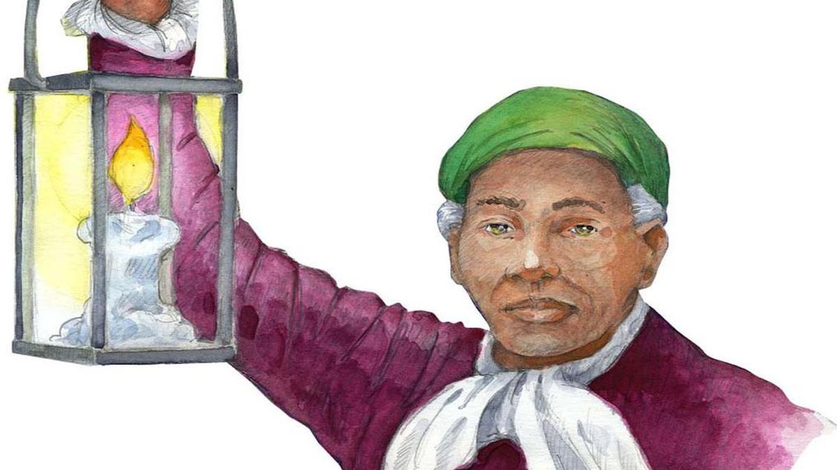 Harriet Tubman holds a lantern to light the Underground Railroad.