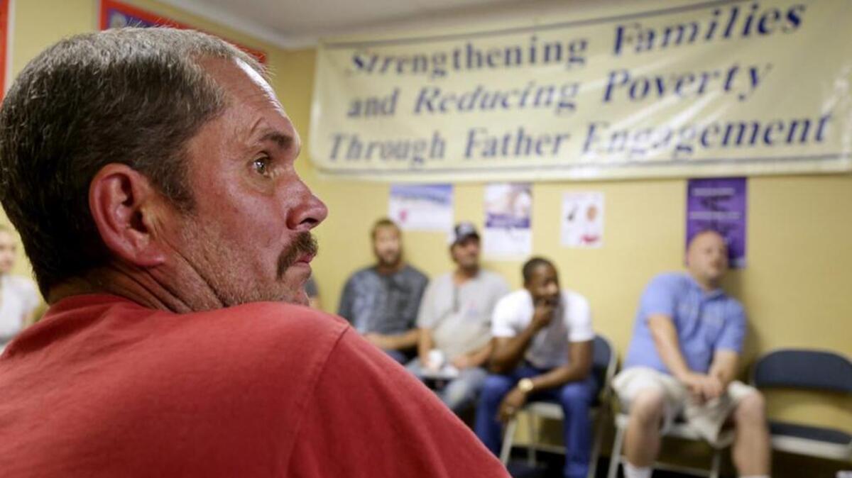 Wayne Duncan leads a Midlands Fatherhood Coalition meeting about financial stability and economic development. The coalition is one of the projects funded by the Sisters of Charity Foundation.
