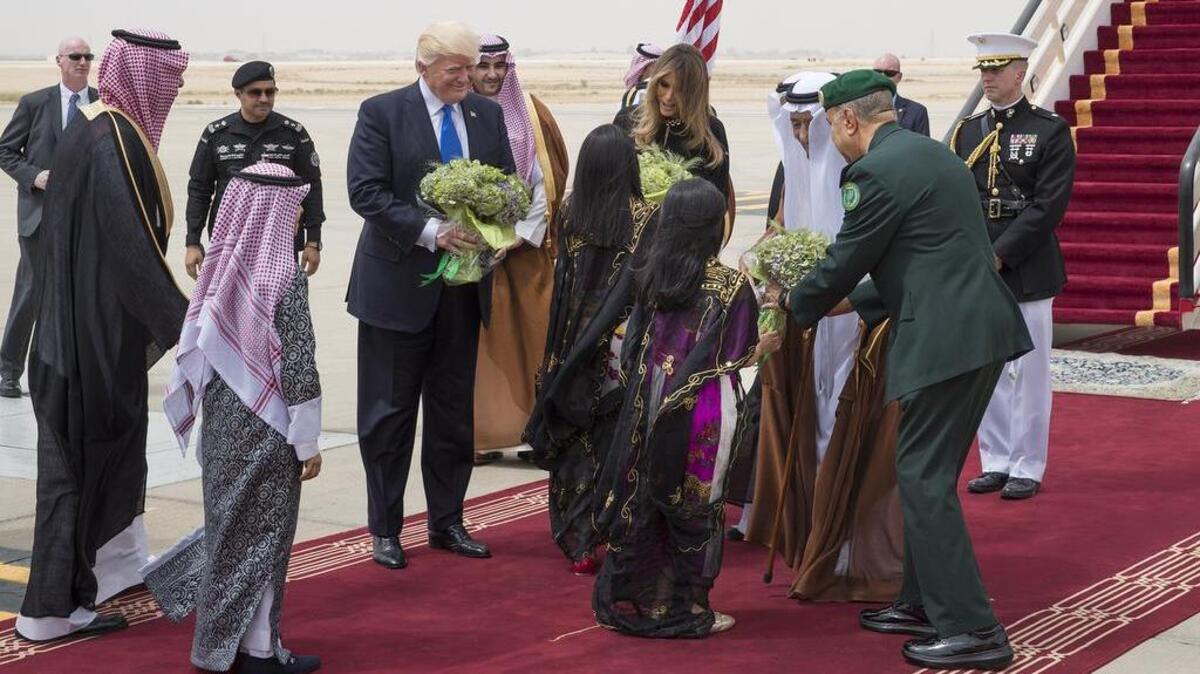 Flatter our president, and you can do whatever you want at home. Here, Saudi children present President Donald Trump and first lady Melania Trump with flowers on their arrival in Riyadh, Saudi Arabia.