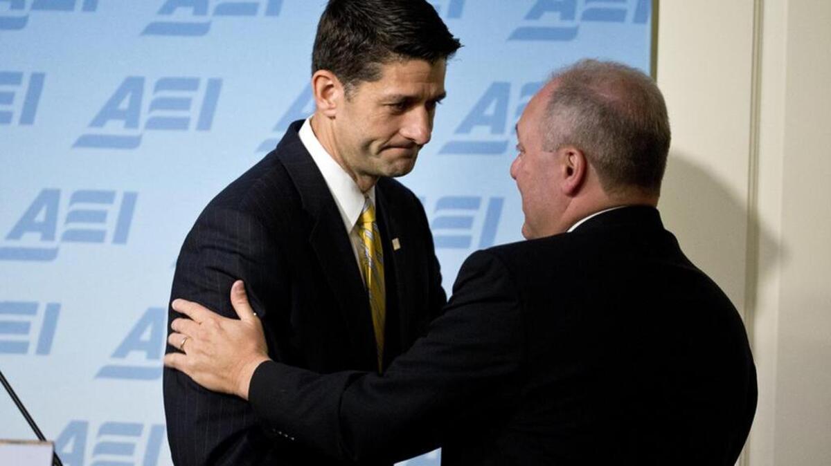 House Speaker Paul Ryan greets House Majority Whip Steve Scalise Wednesday as they speak on new proposals to repeal and replace Obamacare.