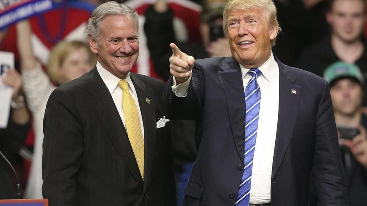 Republican presidential candidate Donald Trump, right, addresses a a campaign rally in Florence along with SC Lt. Gov. Henry McMaster.