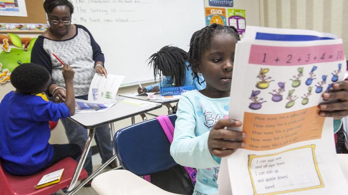 Ramona Stancil works with first-graders in her after-school class at Teach My People, a Pawley’s Island faith-based nonprofit that helps get children up to grade level.