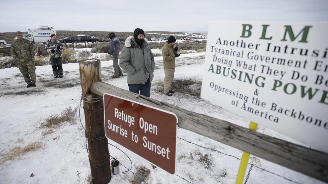 Members of the group occupying the Malheur National Wildlife Refuge headquarters stand guard Monday near Burns, Ore.