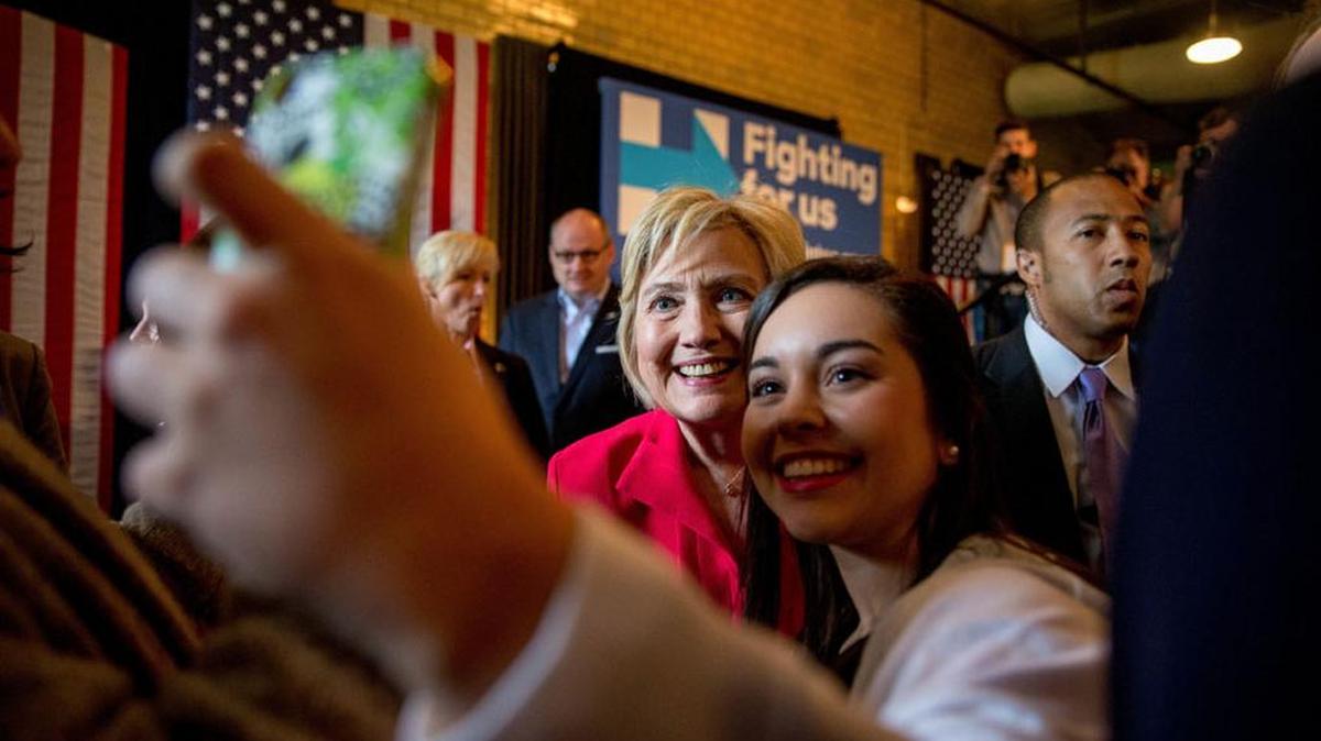 Democratic presidential candidate Hillary Clinton takes a photograph with a supporter after speaking at a get out the vote event on Monday in Bowling Green, Ky.