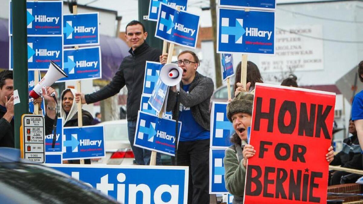 Supporters of Sen. Bernie Sanders and Former Secretary of State Hillary Clinton lined Assembly Street to get attention for their candidate before the CNN S.C. Democratic Presidential Town Hall at USC on Tuesday.