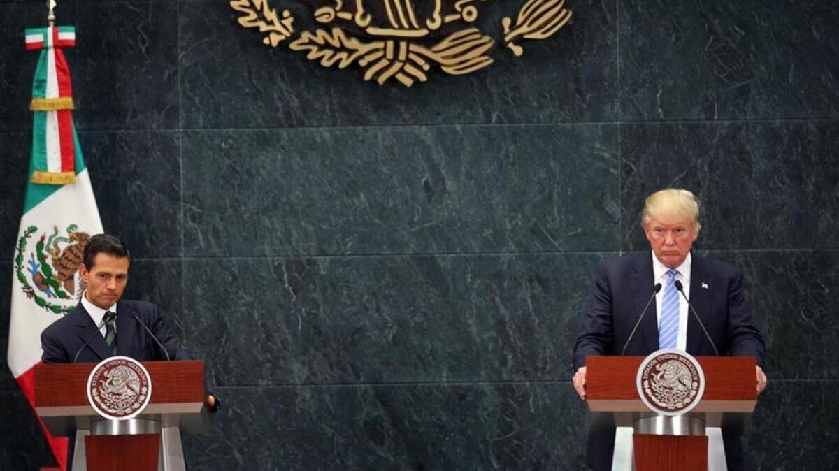 Republican presidential candidate Donald Trump and Mexico President Enrique Pena Nieto listen to a reporter's question during a joint statement at Los Pinos, the presidential official residence, in Mexico City, on Aug. 31.