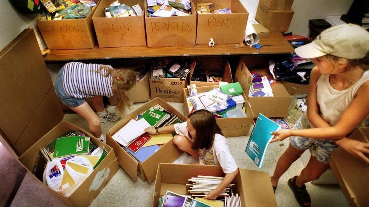 Volunteers of all ages help the Cooperative Ministry sort donations and in other ways fulfill its mission of helping Columbia-area families work their way out of poverty.