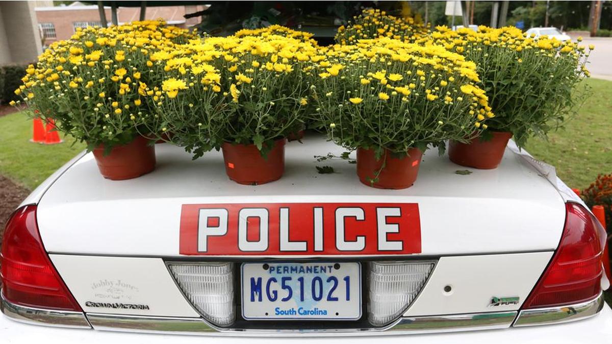 
Forest Acres residents brought flowers to the police department to pay respects to Officer Greg Alia, who was shot to death Wednesday morning.
