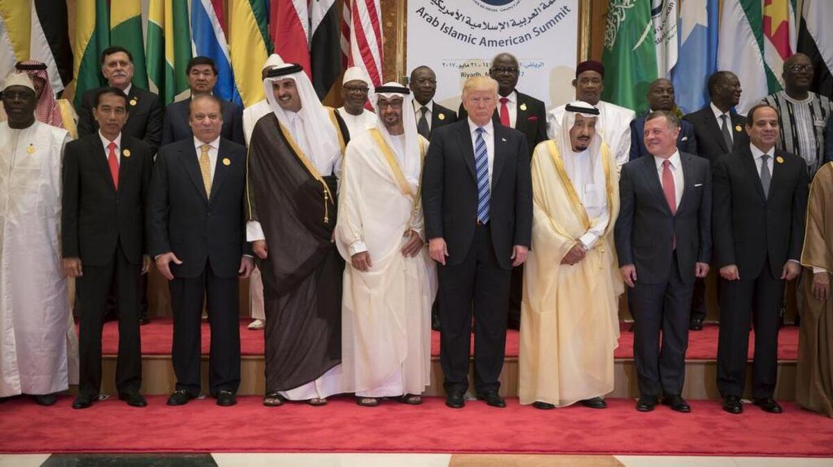 President Donald Trump, center, poses with world leaders during the Arabic Islamic American Summit in Riyadh, Saudi Arabia.