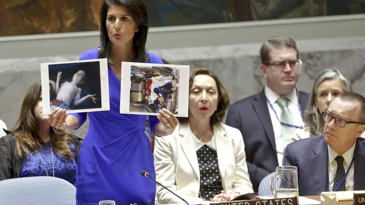 Nikki Haley, US Ambassador United Nations, shows pictures of Syrian victims of chemical attacks as she addresses a meeting of the Security Council on Syria a week ago.