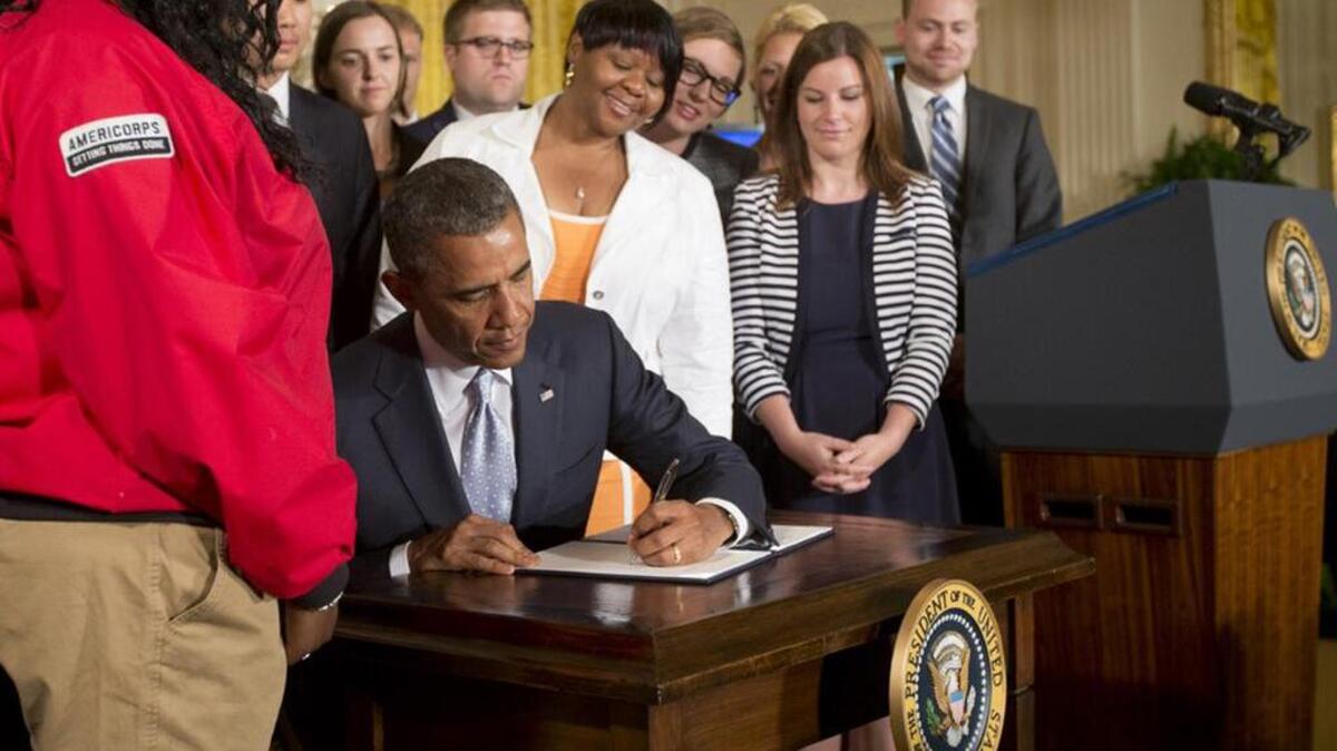 President Barack Obama signs a Presidential Memorandum in 2014 on reducing the burden of student loan debt. Like most of his ‘signature’ items, this one will be subject to a Donald Trump repeal.