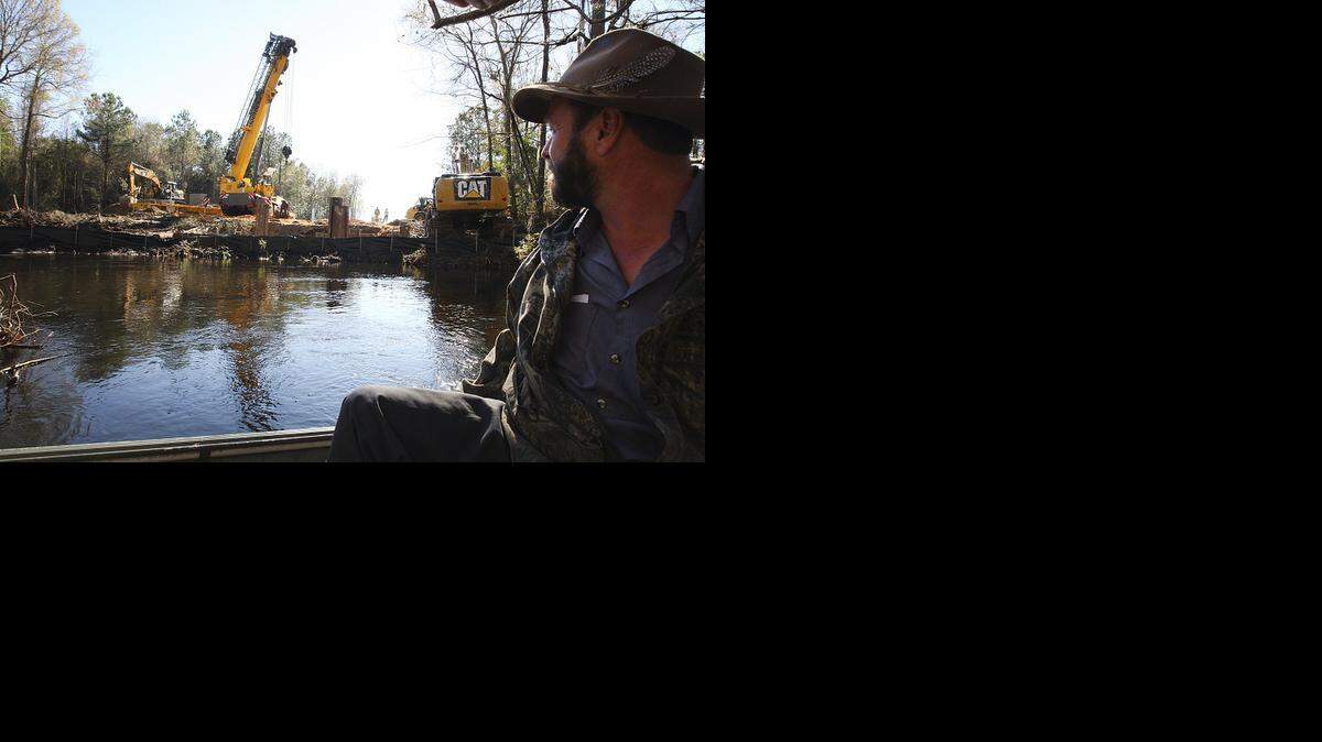 
Crews work on the piping system necessary to siphon water from the South Fork of the Edisto River to irrigate an Aiken County potato farm. Farm use of river water is under debate in the Legislature.
