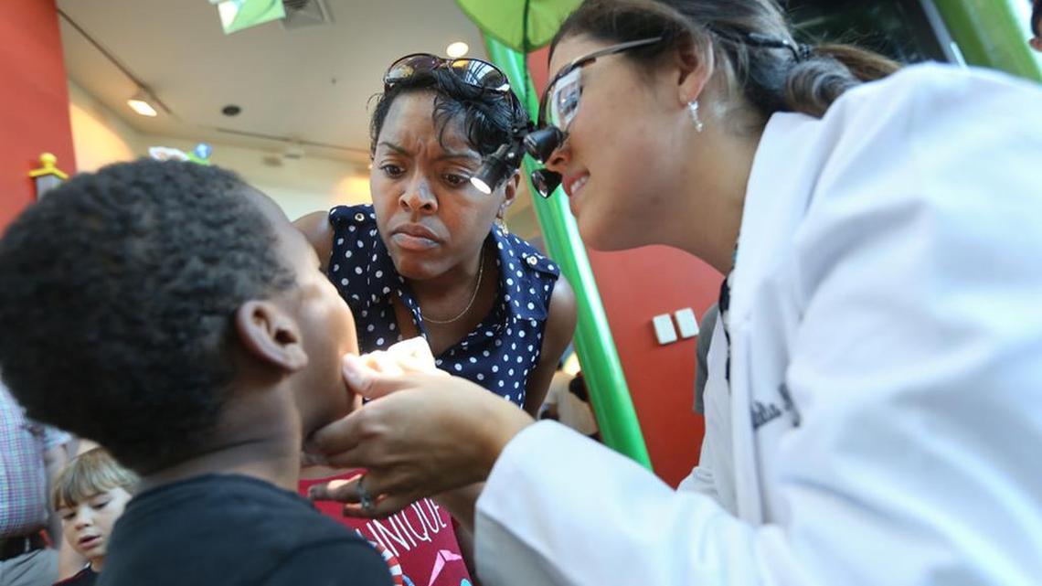Dr Natalia Nunez Antley shows Rosie Quiller her son’s teeth during EdVenture’s Countdown to Kindergarten last summer.