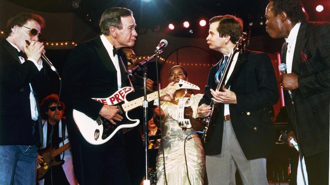Then-President George H.W. Bush and his Republican National Committee chairman, Lee Atwater, accompany a band during a rhythm and blues concert in Washington on Jan. 21, 1989. Bush was inaugurated one day earlier.